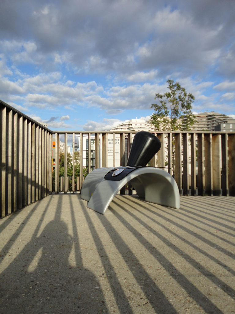 Frankfort Factory, a one-of-a-kind Affordance seat in white and glossy black, on a Paris terrace